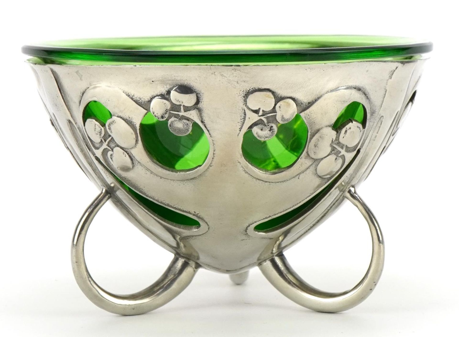 Archibald Knox for Liberty & Co, Arts & Crafts pewter three footed pierced bowl with green glass