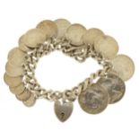 Silver coin bracelet with love heart padlock set with a selection of antique and later coinage