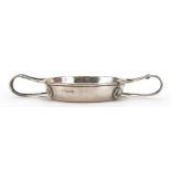 A E Jones, Arts & Crafts circular silver quaich with twin handles and planished body numbered 501 to