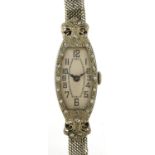 Ladies 18ct white gold cocktail wristwatch set with diamonds on white metal strap housed in a