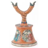 Chinese Islamic pottery candlestick decorated in low relief and hand painted with roundels of