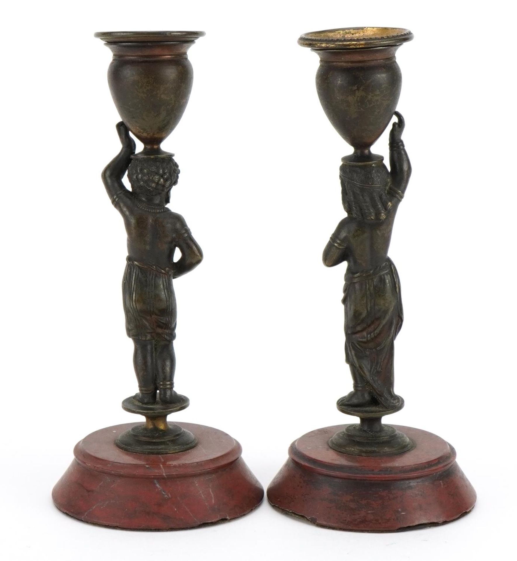 Pair of 19th century French patinated bronze Blackamoor candlesticks raised on circular rouge marble - Image 2 of 3
