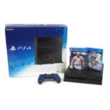 PlayStation 4 games console with box, controller and games