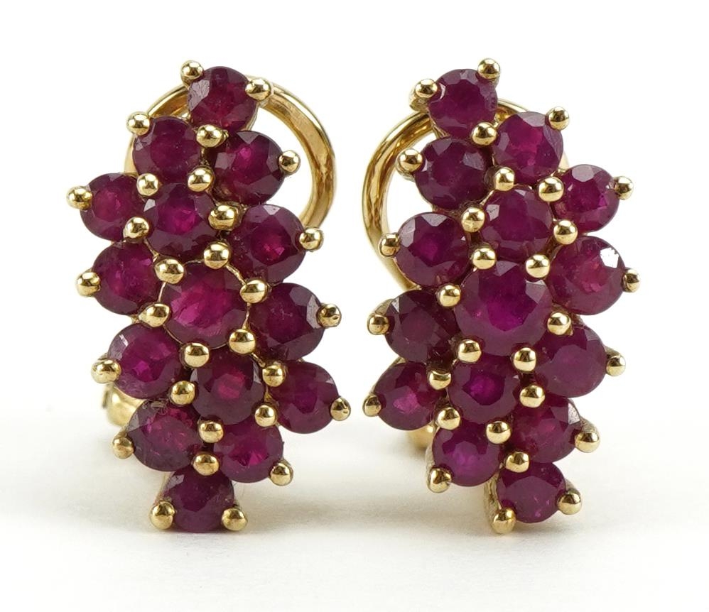 Pair of 9ct gold ruby three row cluster earrings, 1.6cm high, 3.3g