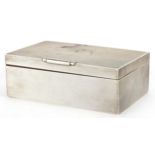 W H Manton, Elizabeth II Art Deco style silver cigarette box with engine turned decoration,