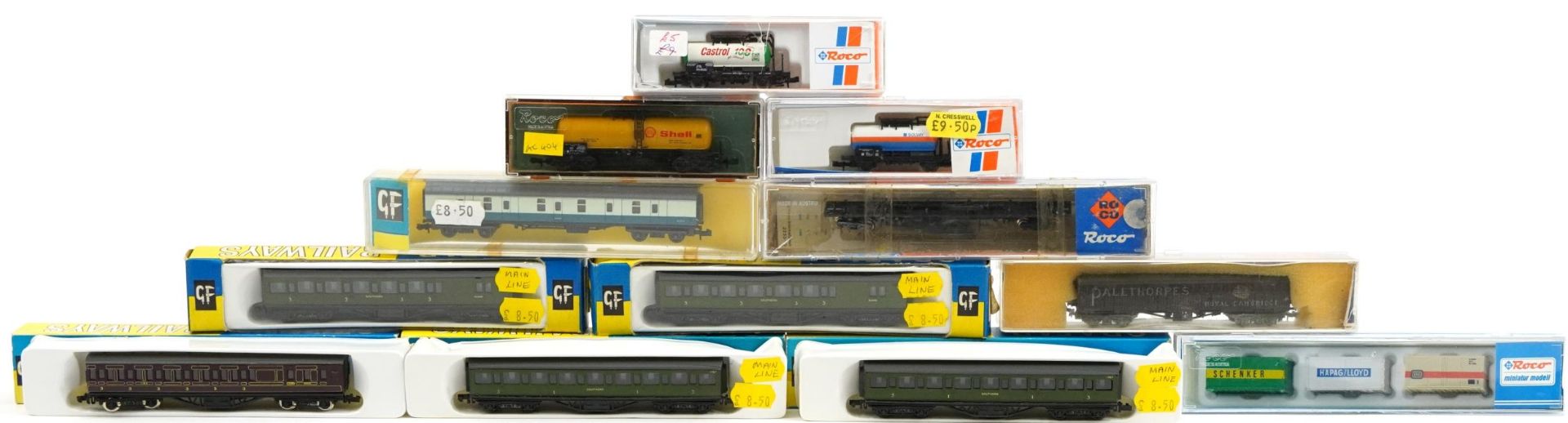 Twelve N gauge model railway carriages, tankers and wagons with boxes and cases including Graham