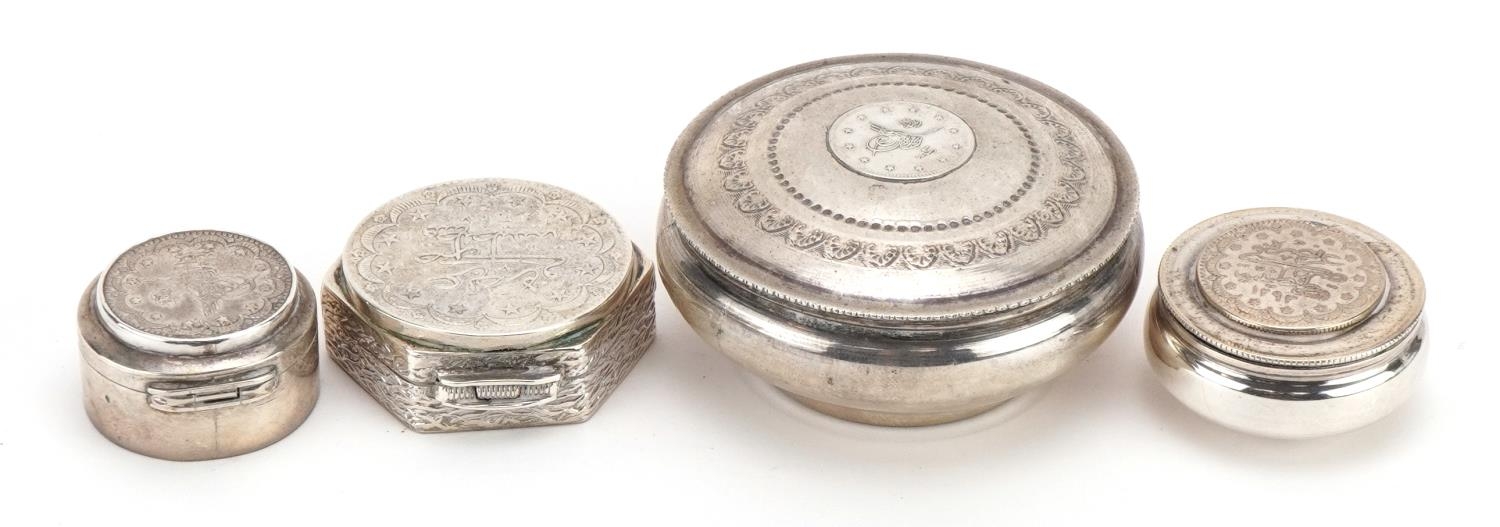 Four Persian silver coin set pill boxes and trinkets, each with impressed marks, the largest 6.2cm - Image 2 of 4