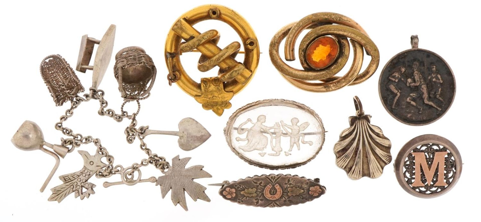 Victorian and later jewellery including silver charm bracelet, yellow metal brooches with engraved