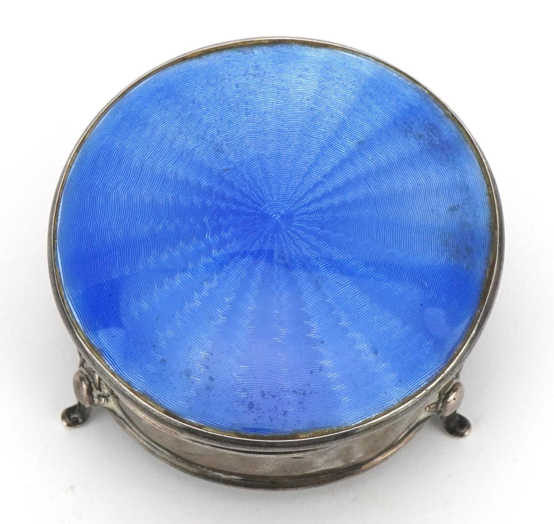 George V circular silver and blue guilloche enamel jewel box with hinged lid, raised on three - Image 4 of 7