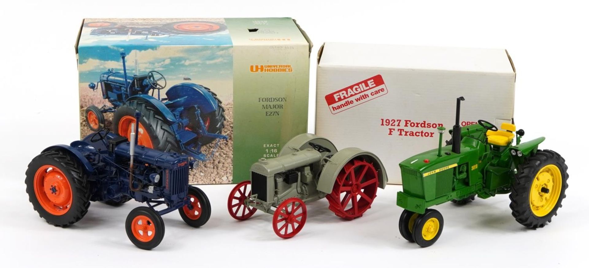 Three diecast model tractors, two with boxes comprising Universal Hobbies Fordson Major E27N, Ertl