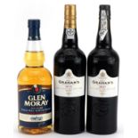 Three bottles of alcohol comprising Graham's Port 2015 and 2017 and Glen Moray single malt Scotch