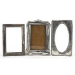 Three silver mounted photo frames, various hallmarks, the largest 18cm x 12.5cm
