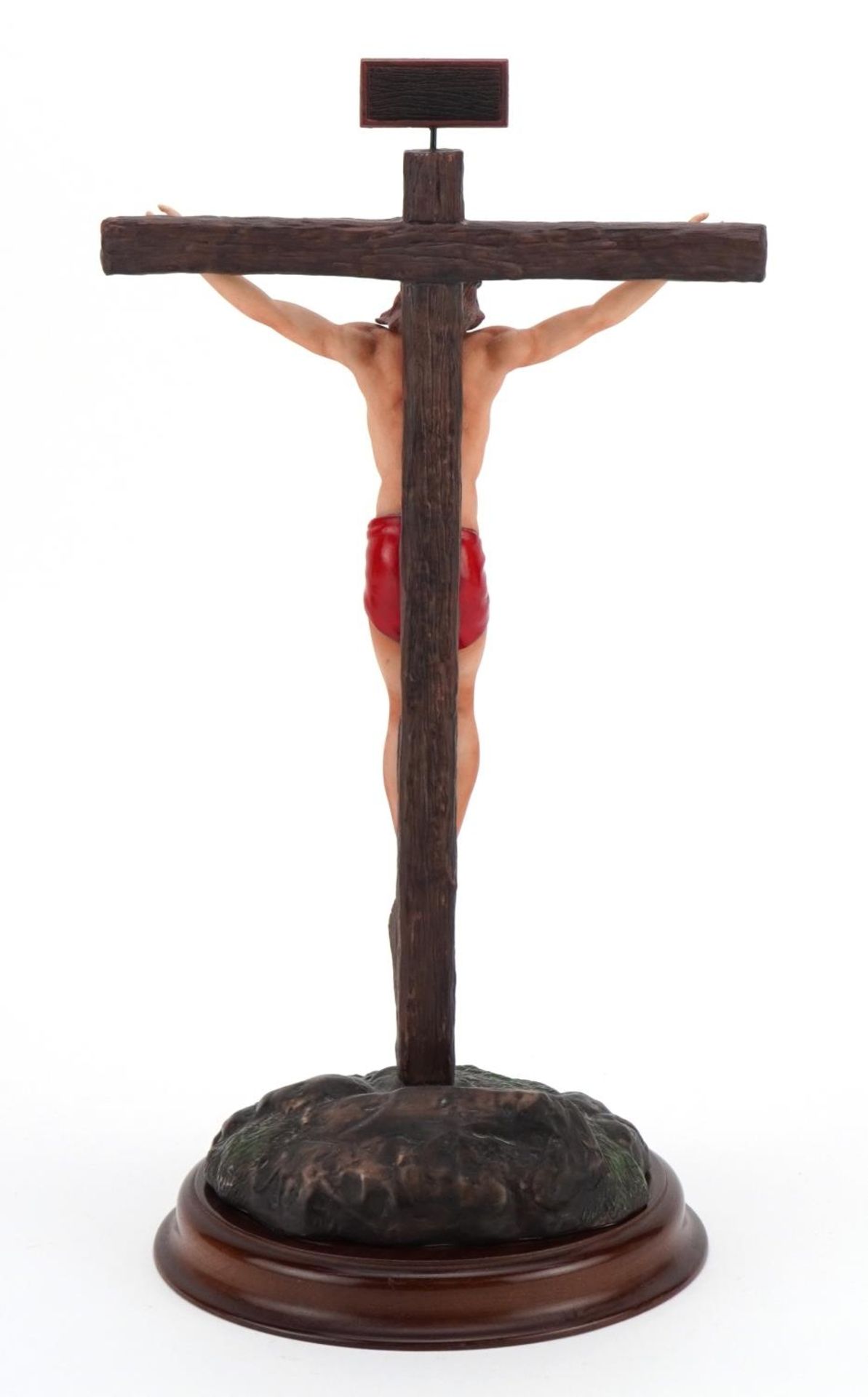 Frankin Mint porcelain model of Christ raised on a circular wood stand titled The Crucifixion, - Image 2 of 3