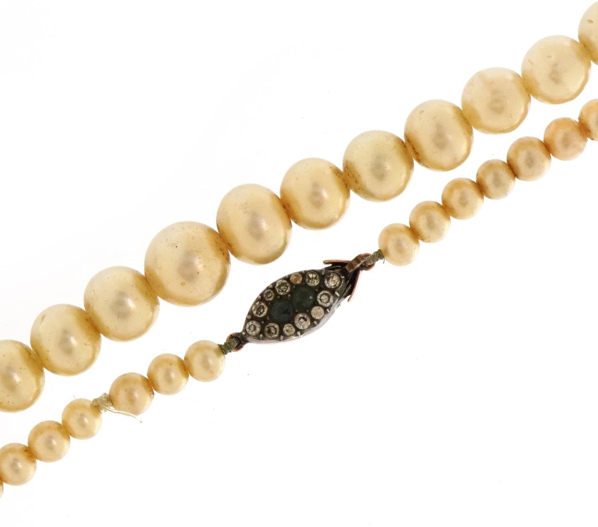 Graduated simulated pearl bead necklace with 9ct rose gold paste set clasp, 78cm in length, 60.8g