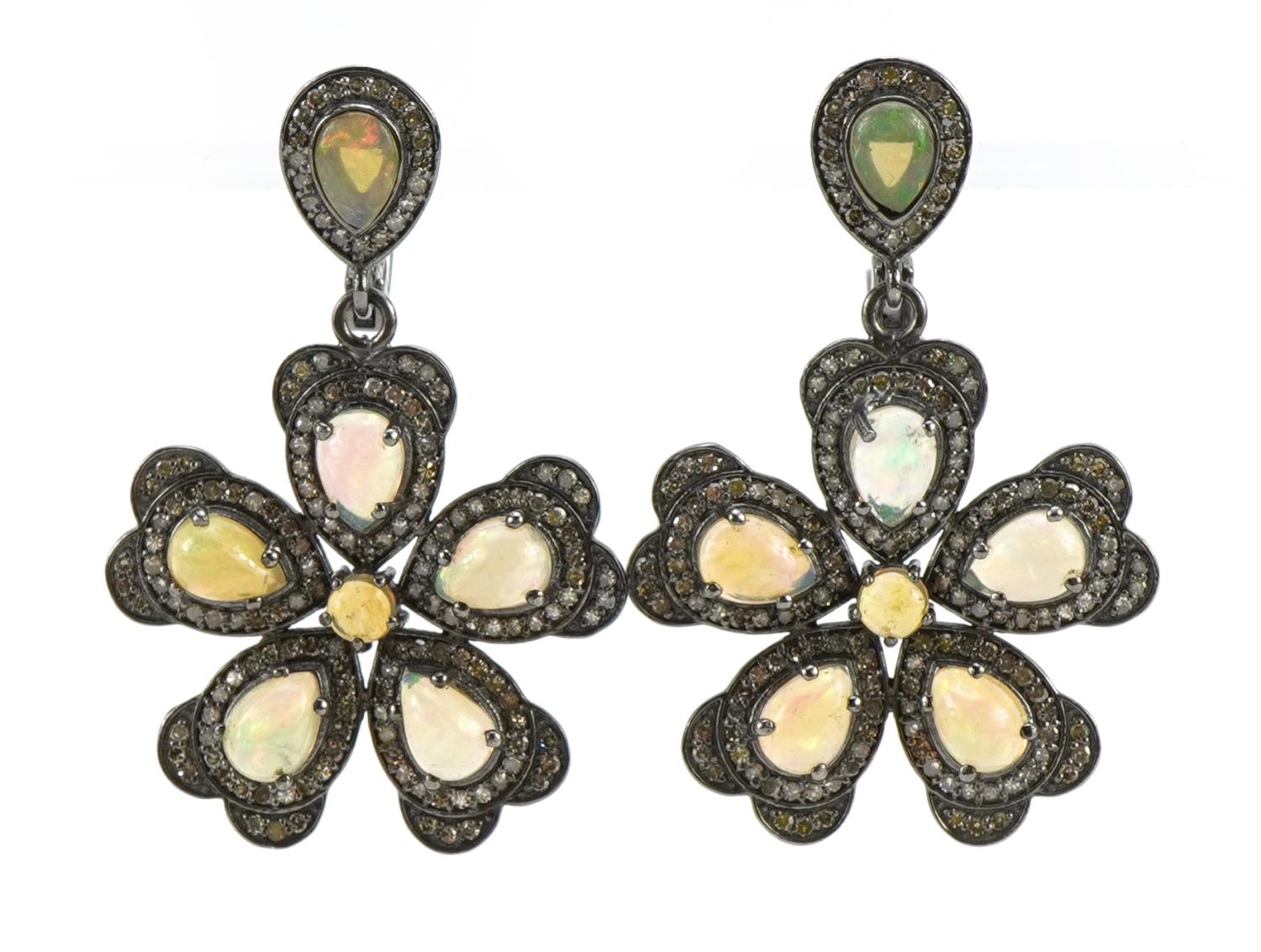 Pair of white metal cabochon opal and diamond flower head drop earrings, 4.5cm high, 14.2g