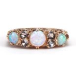 Victorian style 9ct gold clear stone and cabochon opal seven stone ring housed in a Chas