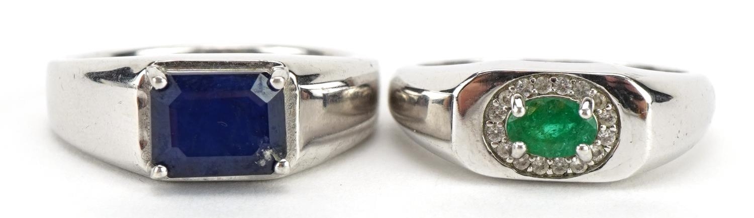 Two silver rings comprising emerald and clear stone and sapphire, the sapphire approximately 9mm x