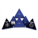 Two Swarovski Crystal Christmas ornaments with boxes comprising dates 2012 and 2013