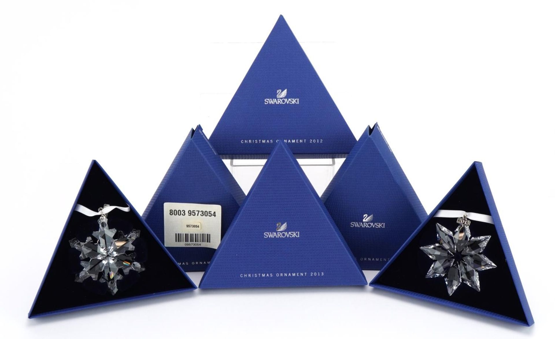 Two Swarovski Crystal Christmas ornaments with boxes comprising dates 2012 and 2013