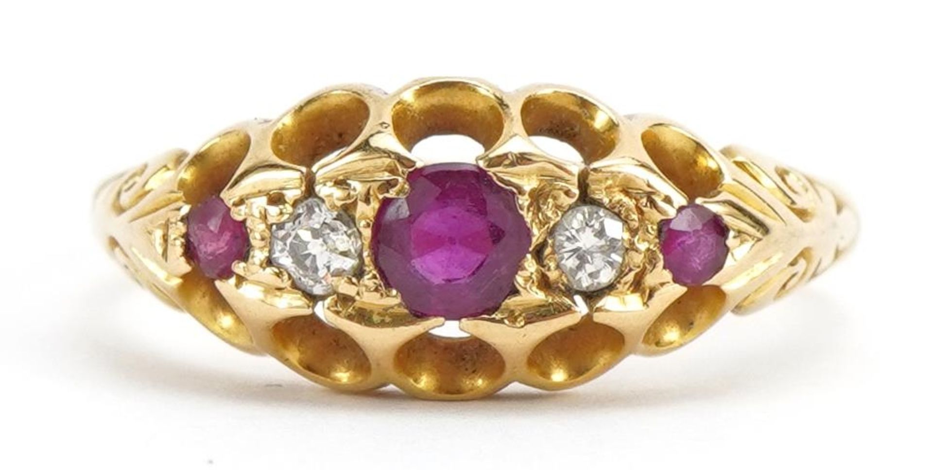 18ct gold ruby and diamond five stone ring, the central ruby approximately 3.4mm in diameter, size