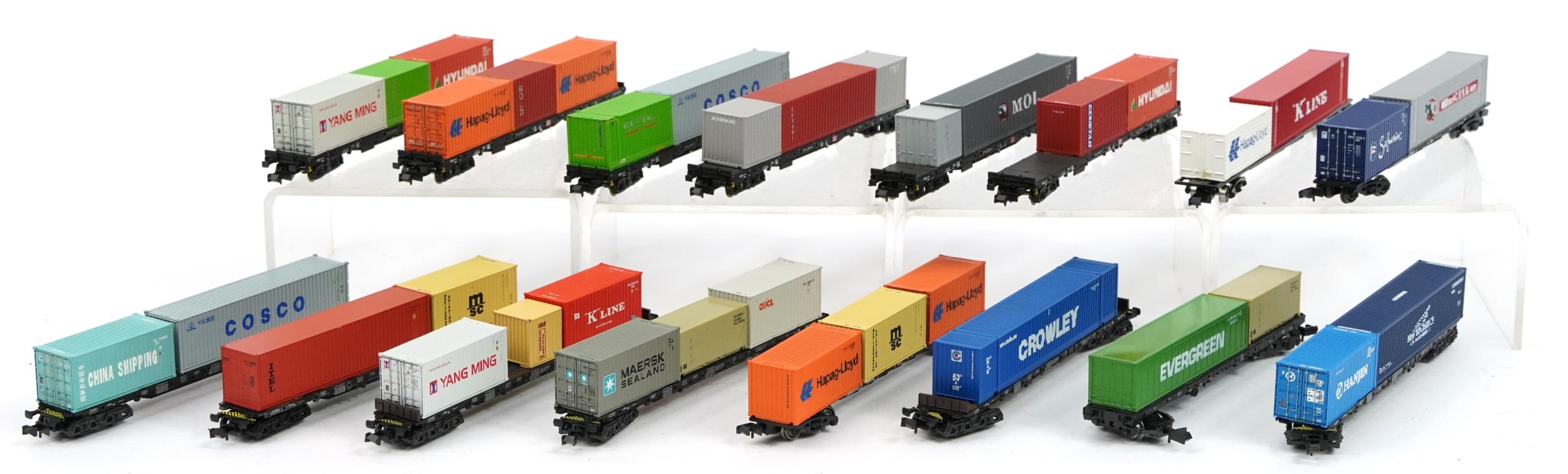 Sixteen N gauge model railway container wagons including Graham Farish, Trix and Minitrix, housed in