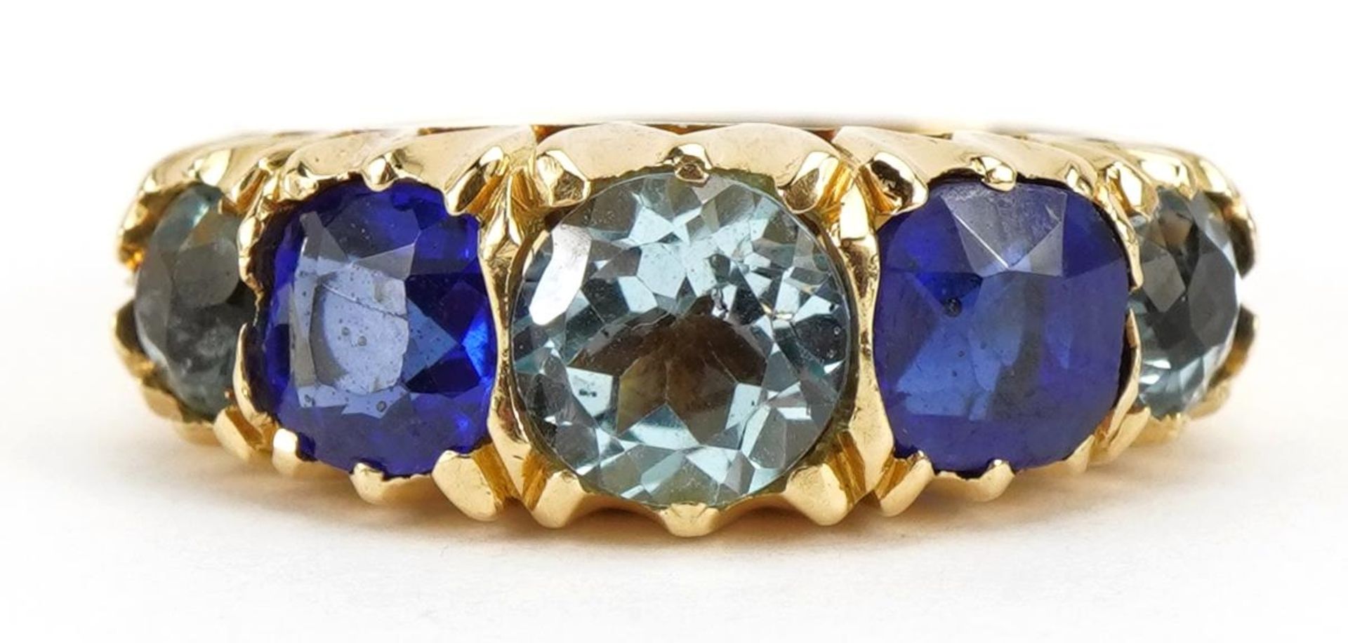 Victorian 18ct gold five stone ring set with blue stones, the largest stone approximately 6.2mm in