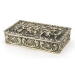 Dutch silver snuff box, the hinged lid embossed with merry figures, impressed marks to the base, 8cm