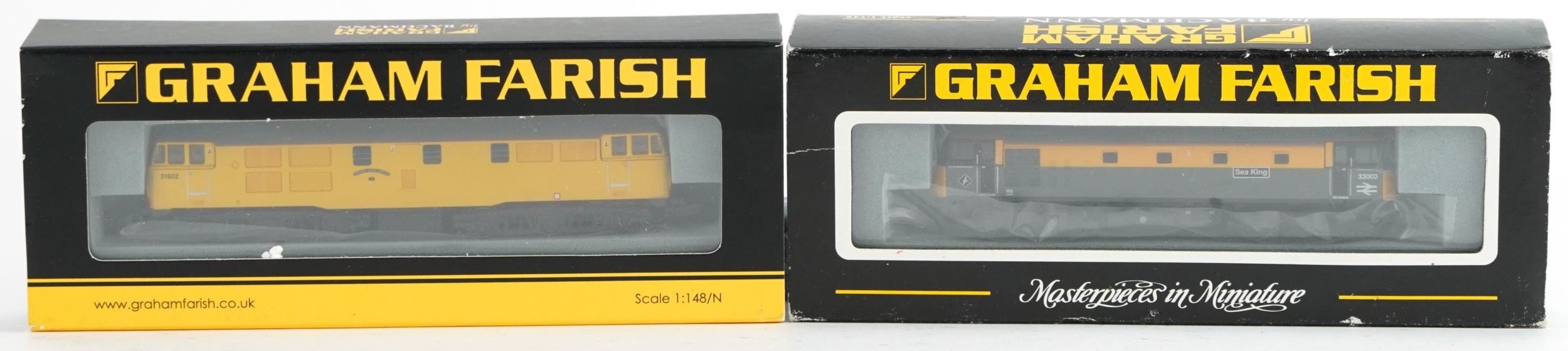 Two Graham Farish N gauge model railway locomotives with cases, numbers 371-105 and 371-130