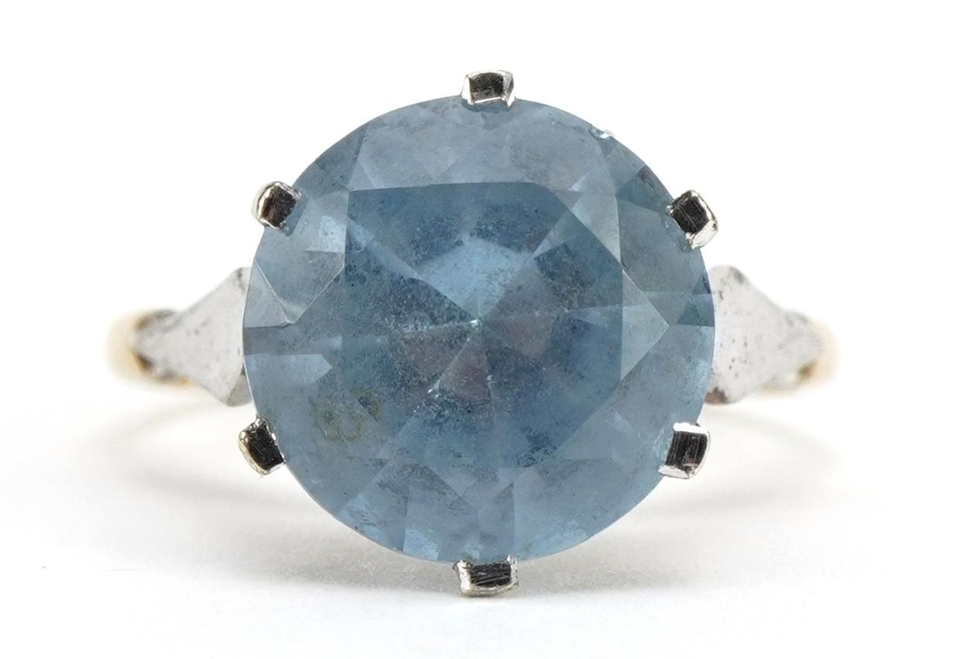 9ct gold blue stone solitaire ring, possibly topaz, the stone approximately 11.3mm in diameter, size