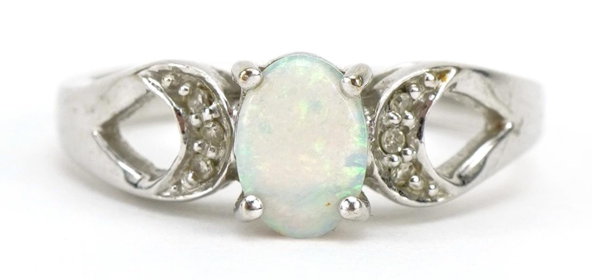 9ct white gold opal and diamond ring with split shoulders, the opal approximately 6.9mm x 4.9mm,