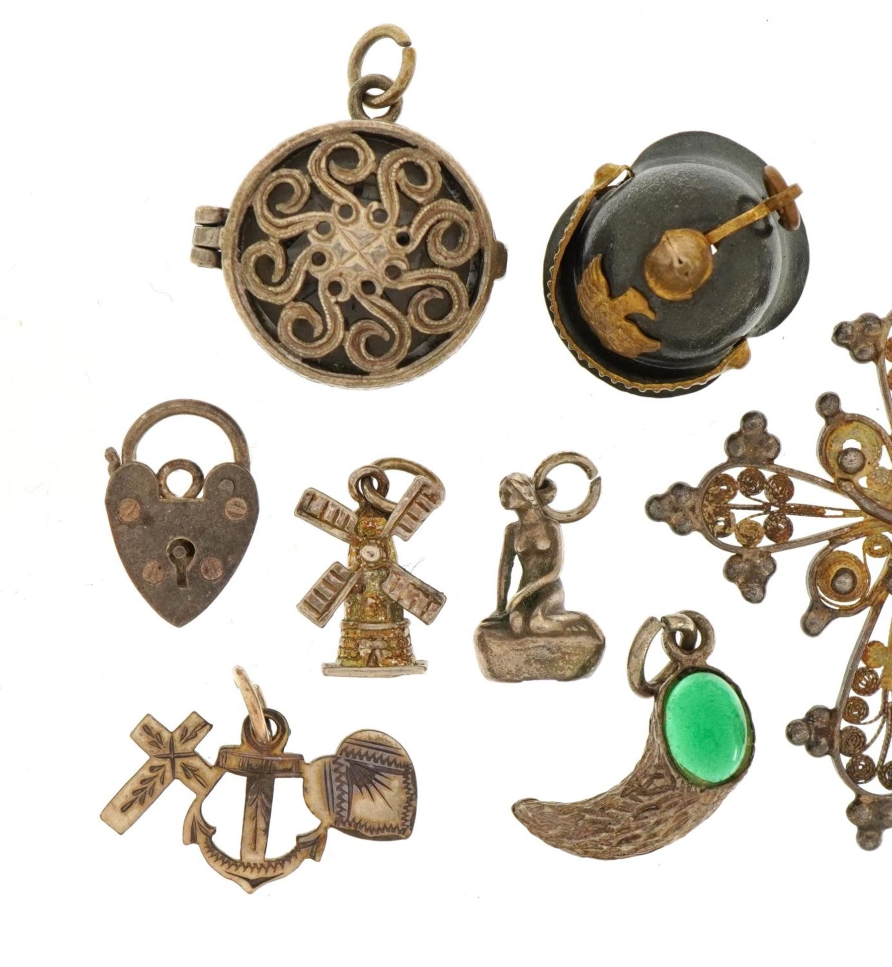 Collection of silver and white metal charms and pendants including a Pickelhaube helmet, crucifix - Image 2 of 4