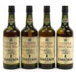 Four bottles of Sandeman Clipper white port