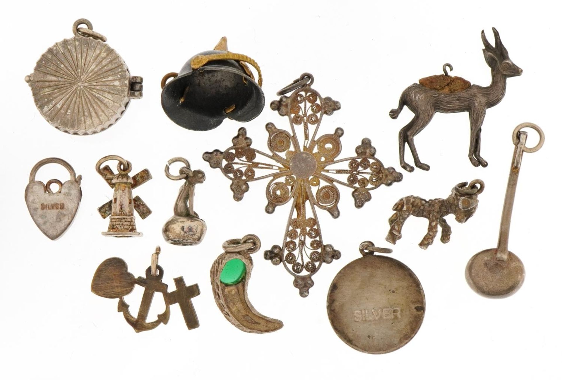 Collection of silver and white metal charms and pendants including a Pickelhaube helmet, crucifix - Image 4 of 4