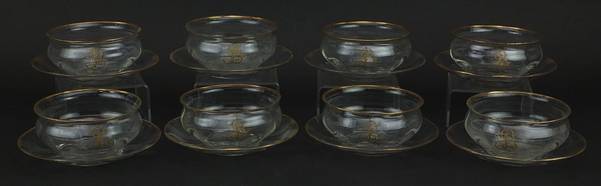 Set of six Venetian glass bowls on stands with gilt monograms and borders, each 11.5cm in diameter