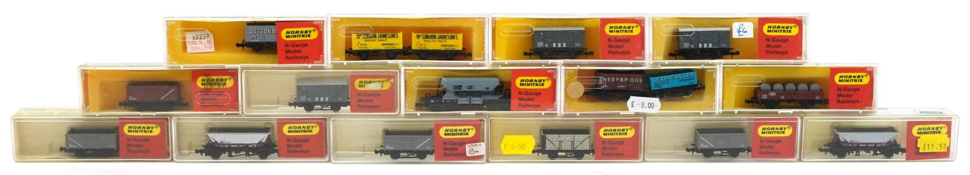 Fifteen Hornby Minitrix N gauge model railway wagons with cases