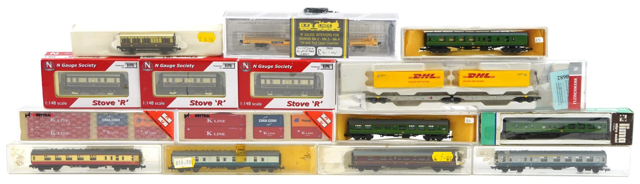 Fifteen N gauge model railway carriages, wagons and container sets with boxes and cases including