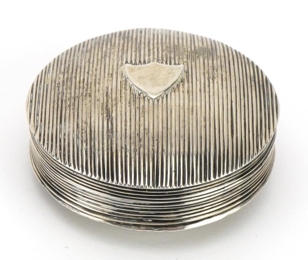 Circular Dutch silver pill box with engine turned decoration, impressed marks to the interior, 5cm