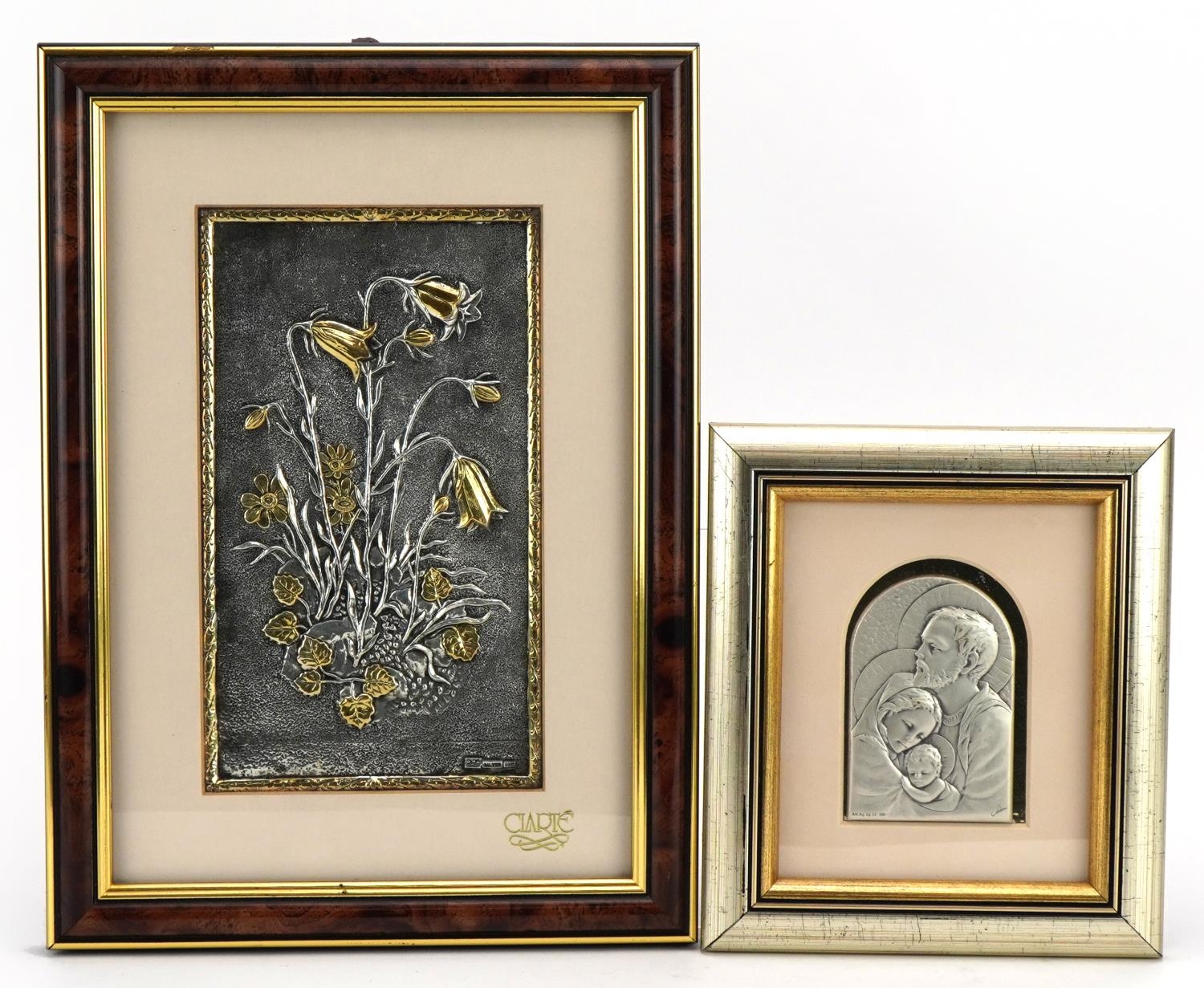 Two silver plaques embossed with religious figures by Obrazek and stylised tulips with 999 silver