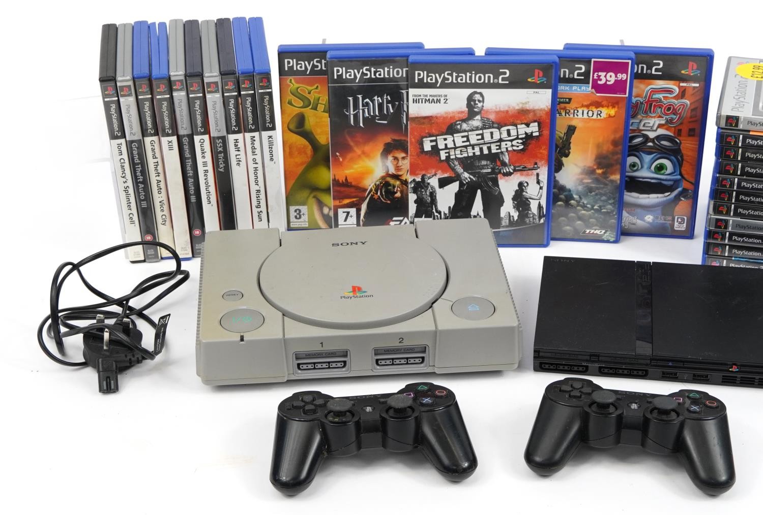 PlayStation 1 and PlayStation 2 Slimline games consoles with controllers and a collection of games - Image 2 of 3