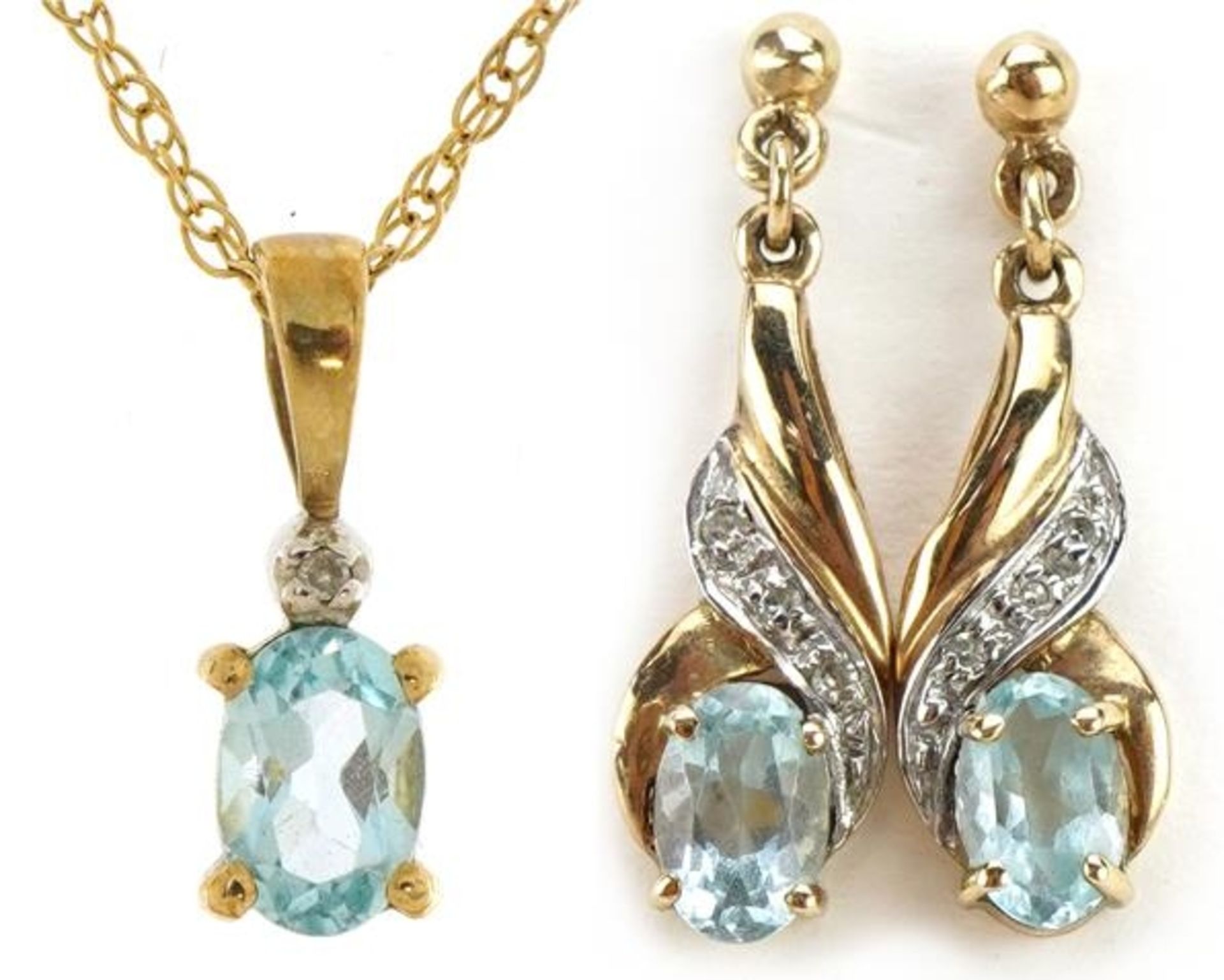 9ct gold blue stone and diamond pendant on a 9ct gold necklace with matching earrings, the pendant