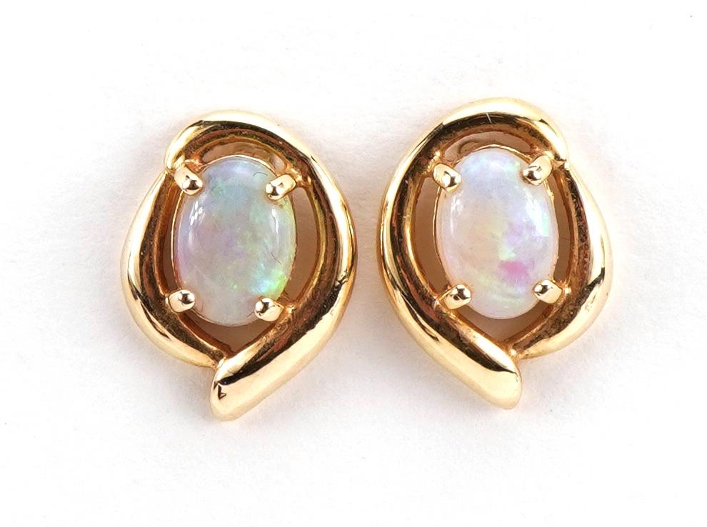 Pair of unmarked gold cabochon opal stud earrings, tests as 9ct gold, 1.3cm high, 1.8g