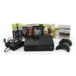 Xbox games console with two controllers and a collection of Xbox 360 games