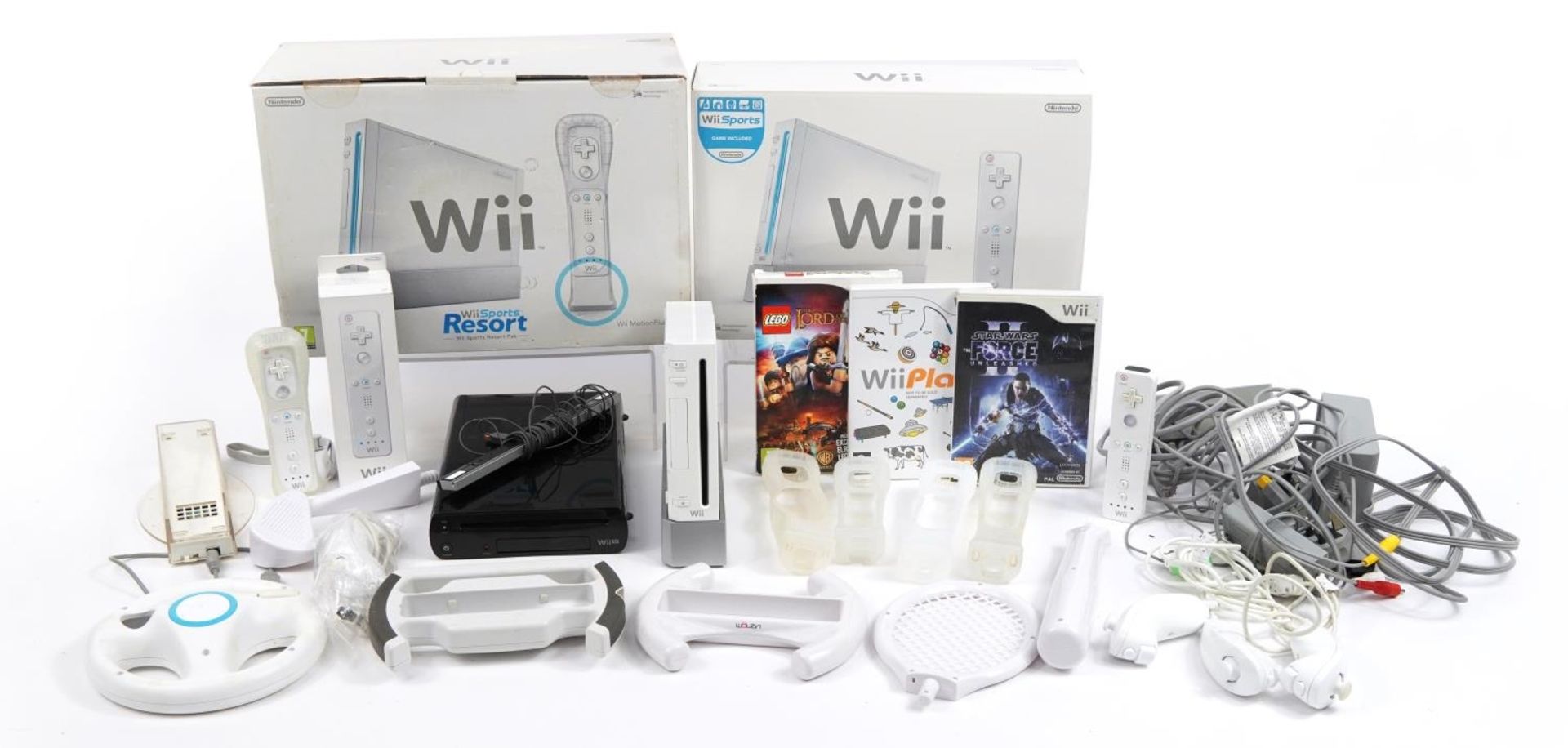 Two Nintendo Wii games consoles with controllers, accessories and games