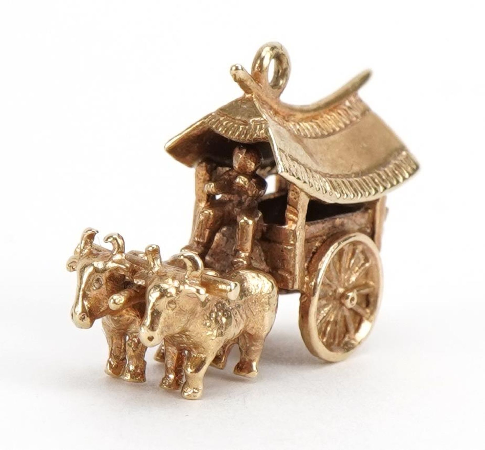 9ct gold Asian cart and buffalo charm, 2.3cm wide, 4.9g