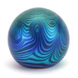 Iridescent art glass paperweight with combed decoration, etched marks to the base, 6.5cm high
