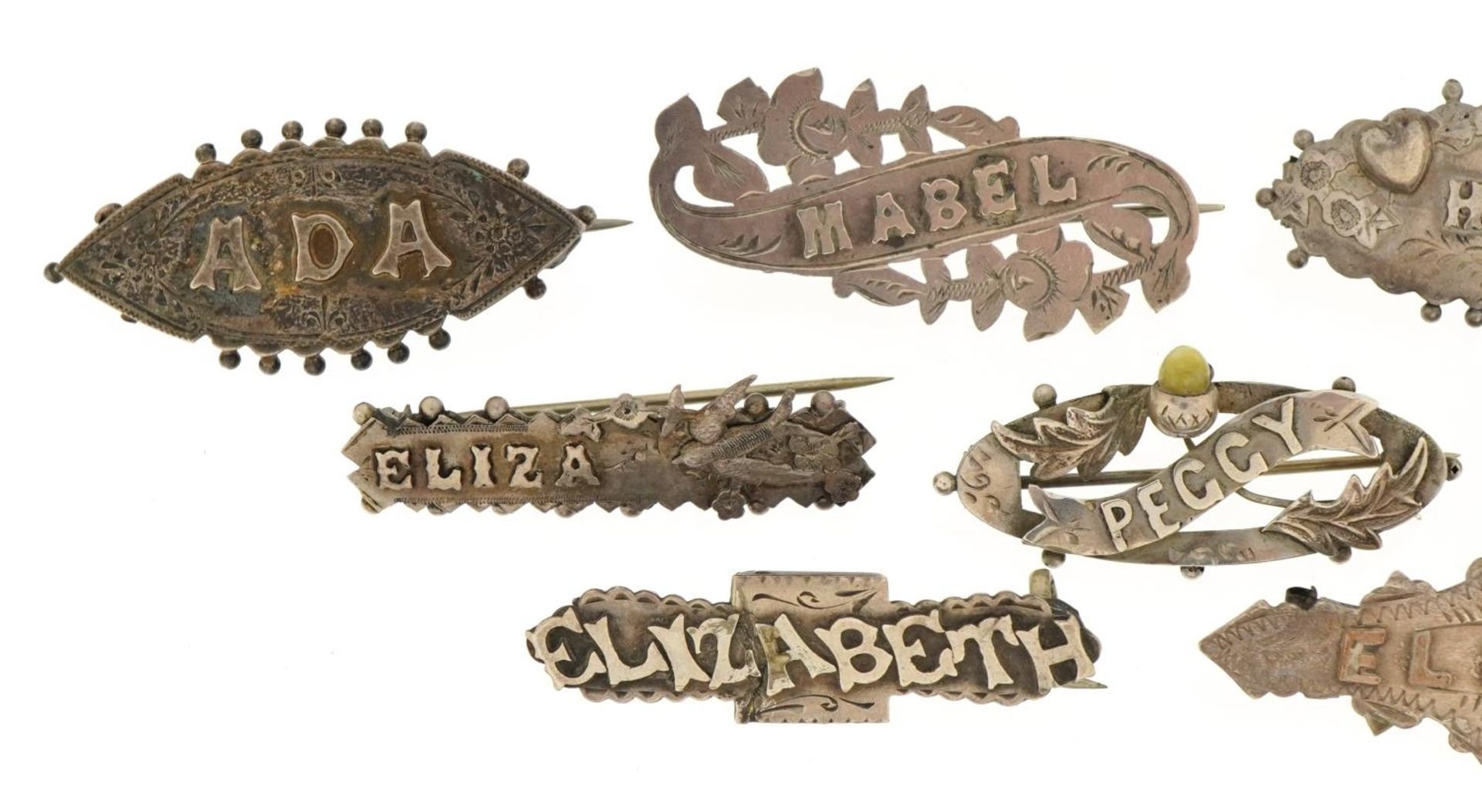 Nine Victorian silver name brooches including Mabel, Eliza and Hilda, the largest 4.3cm wide, - Image 2 of 5