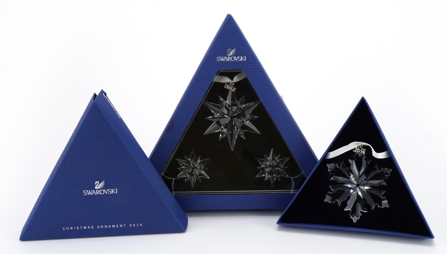 Two Swarovski Crystal Christmas ornaments with boxes comprising dates 2014 and 2017