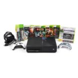 Xbox games console with controllers and a collection of Xbox and Xbox 360 games