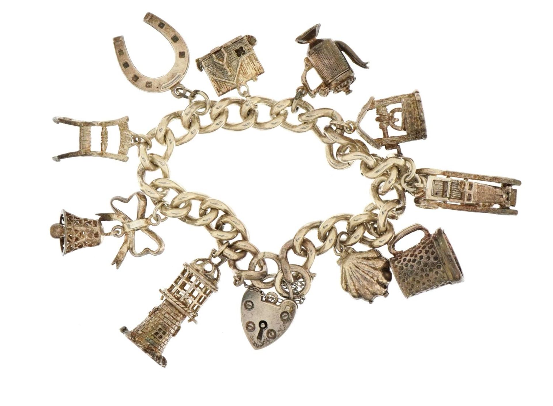 Silver charm bracelet with love heart padlock and a selection of mostly silver charms, including