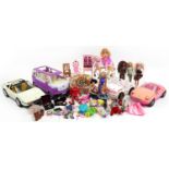Collection of vintage and later Barbie dolls with clothing, accessories and vehicles, the largest